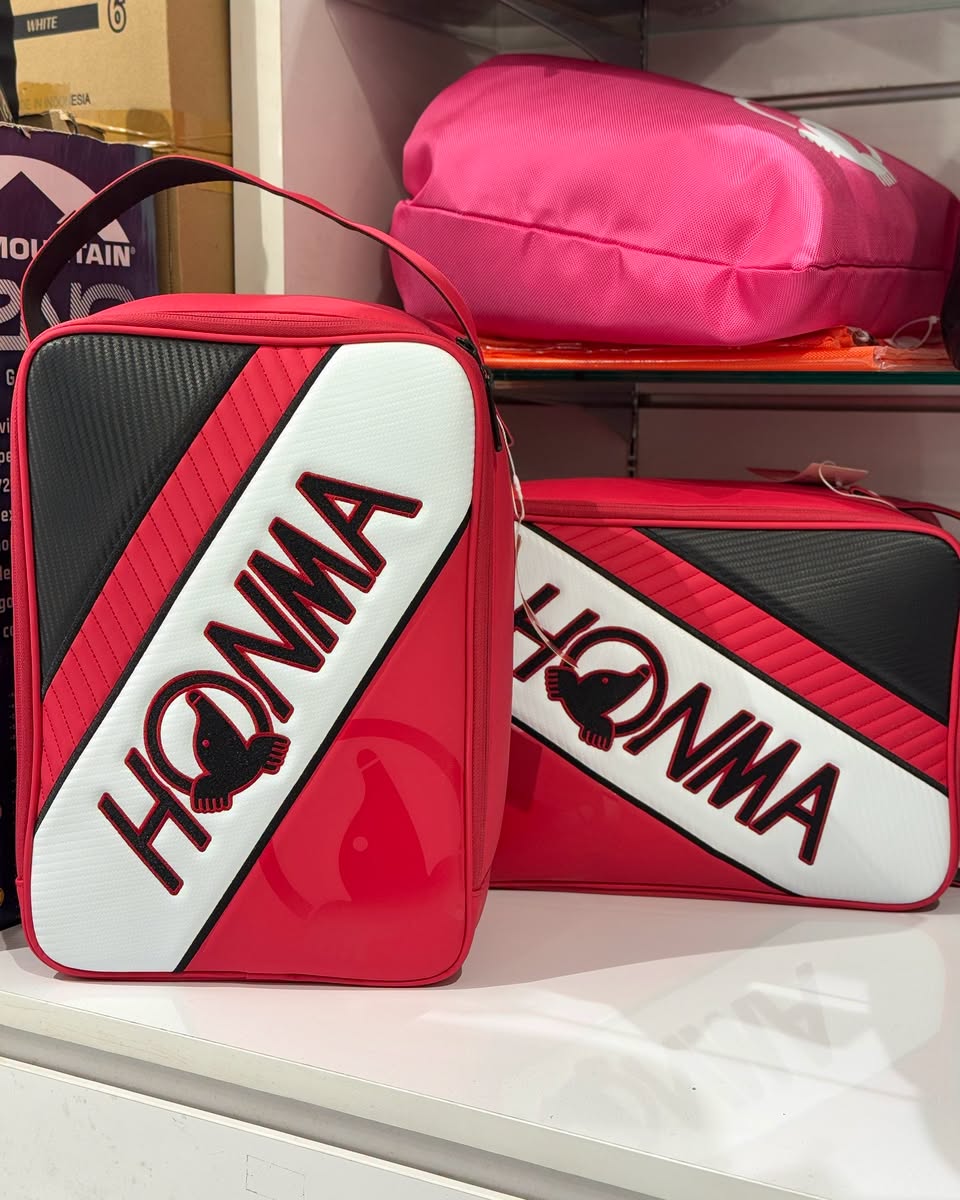 HONMA lunch boxes in red, black and white