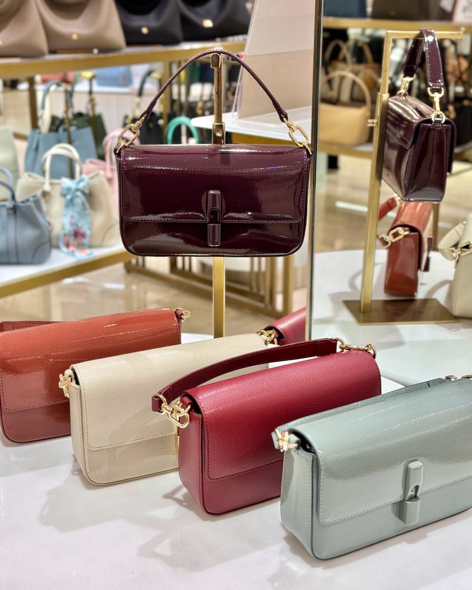 Handbags in maroon, coral, cream, red and mint green with gold-tone hardware