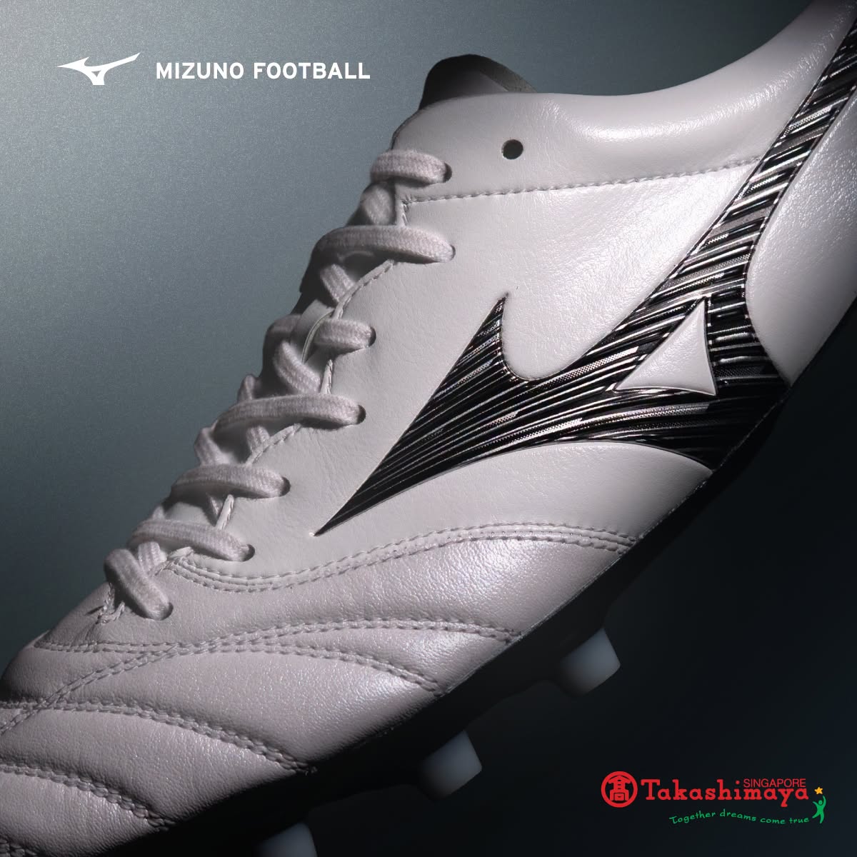 Mizuno football boot with silver wave design