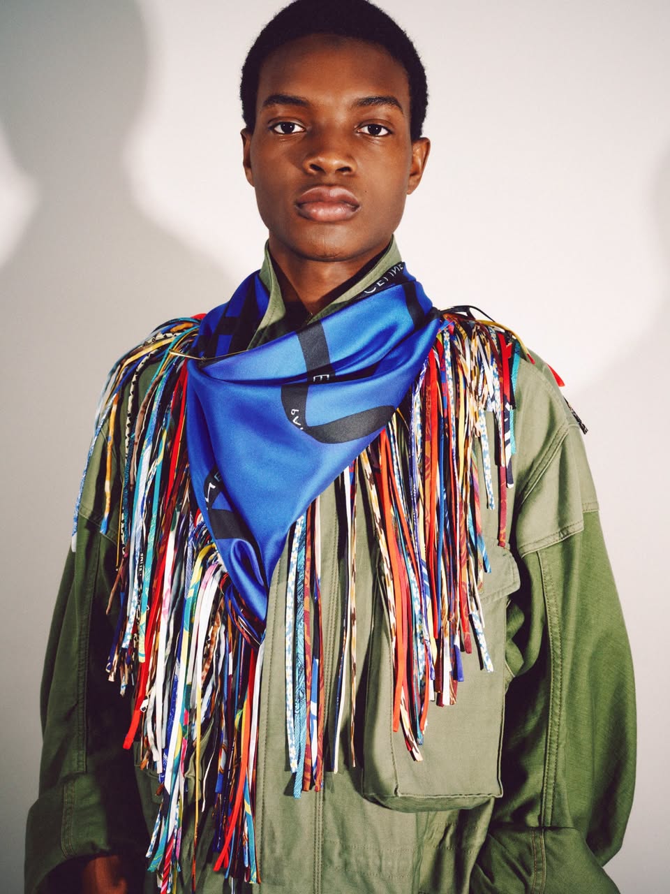 Silk scarf styled with fringe accents