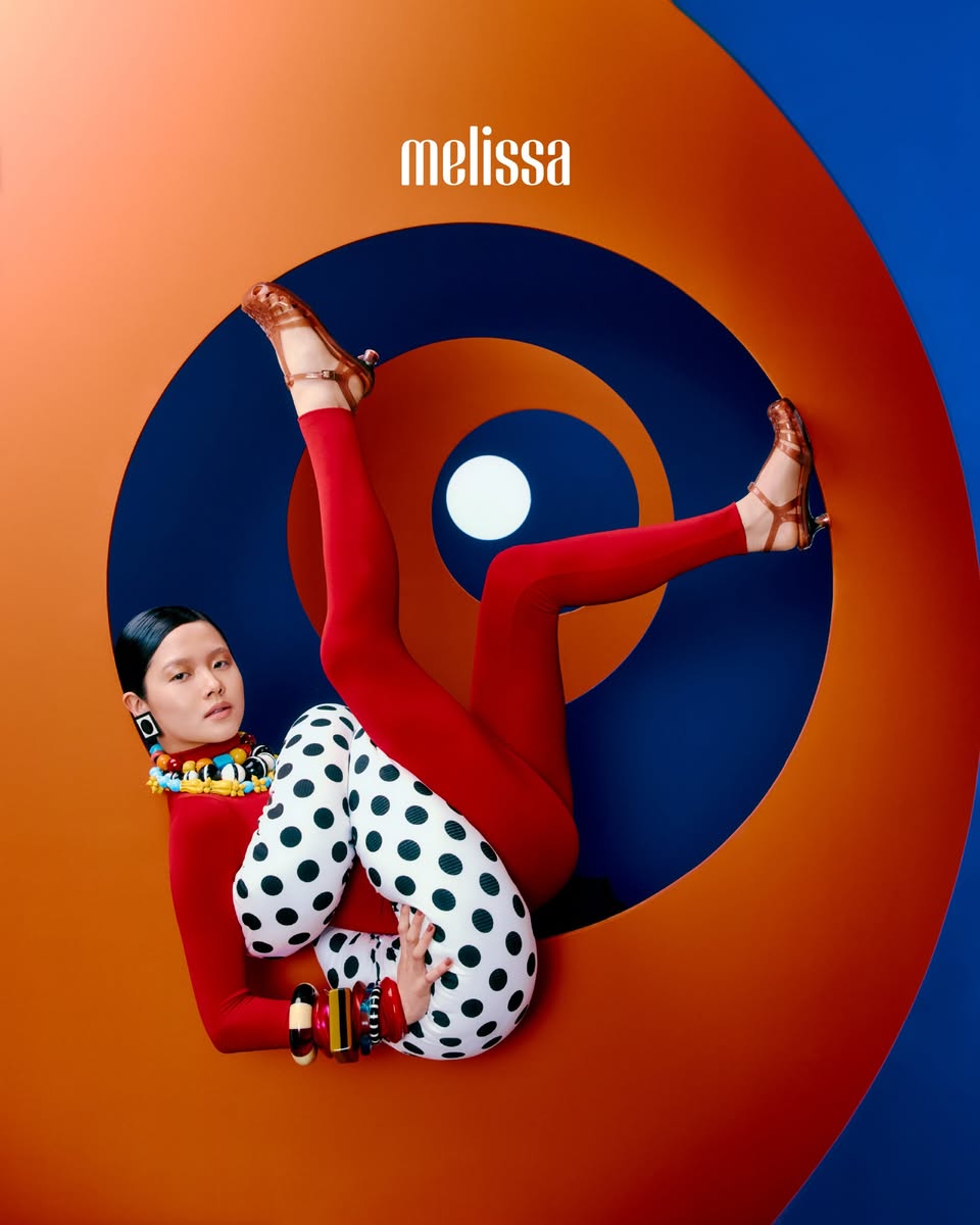 Melissa Fall/Winter 2026 campaign with red leggings and polka-dot pants