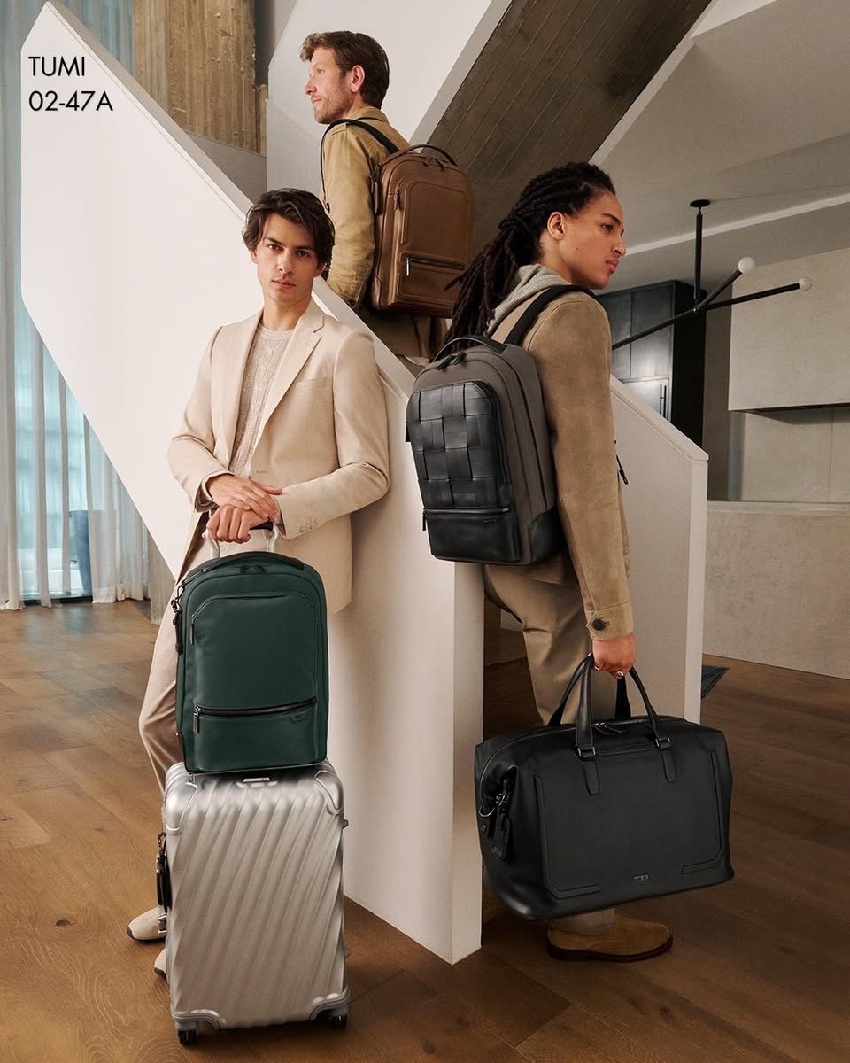 Tumi backpacks, duffel bag and rolling suitcase display