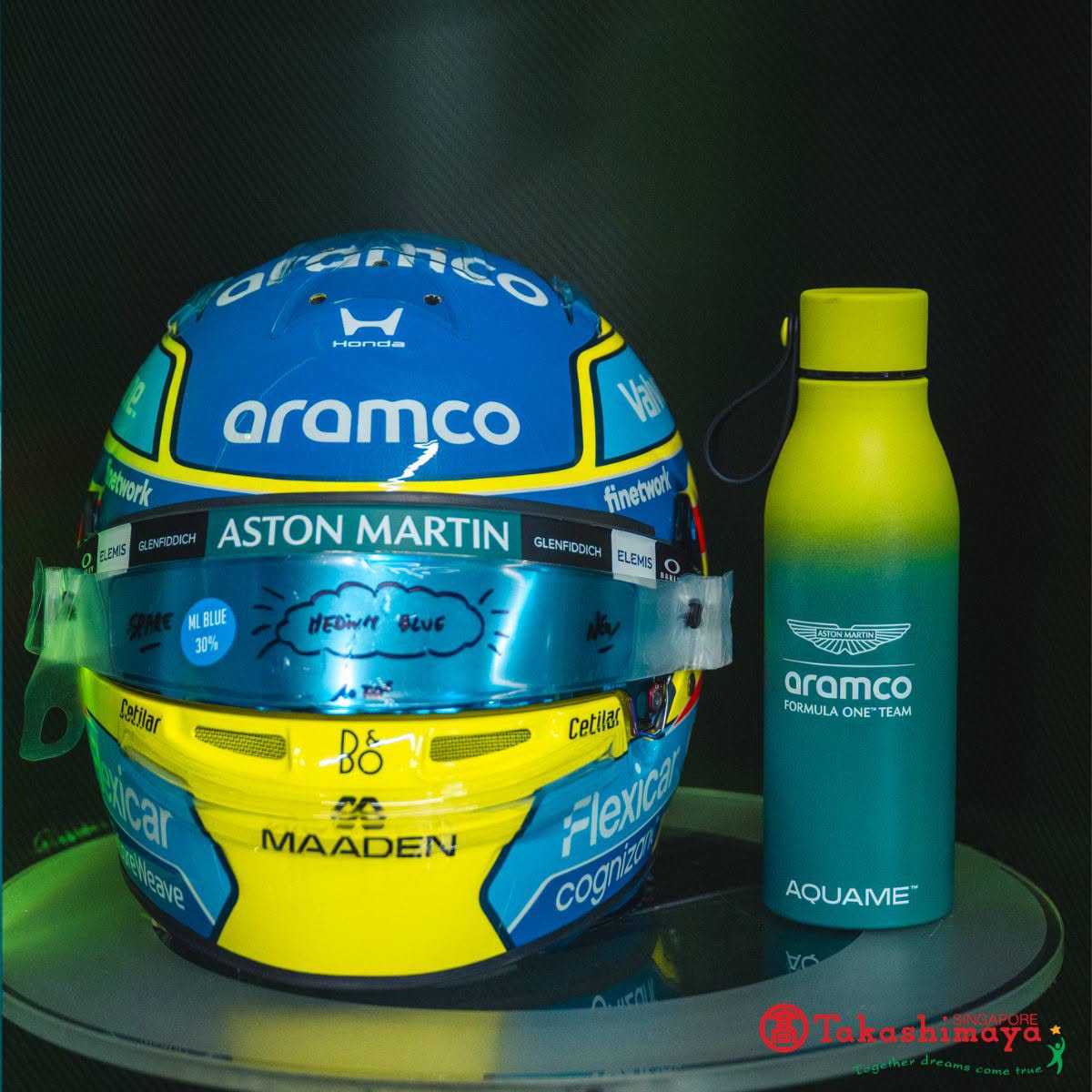 Aston Martin Aramco F1 racing helmet and Aquame water bottle at Takashimaya
