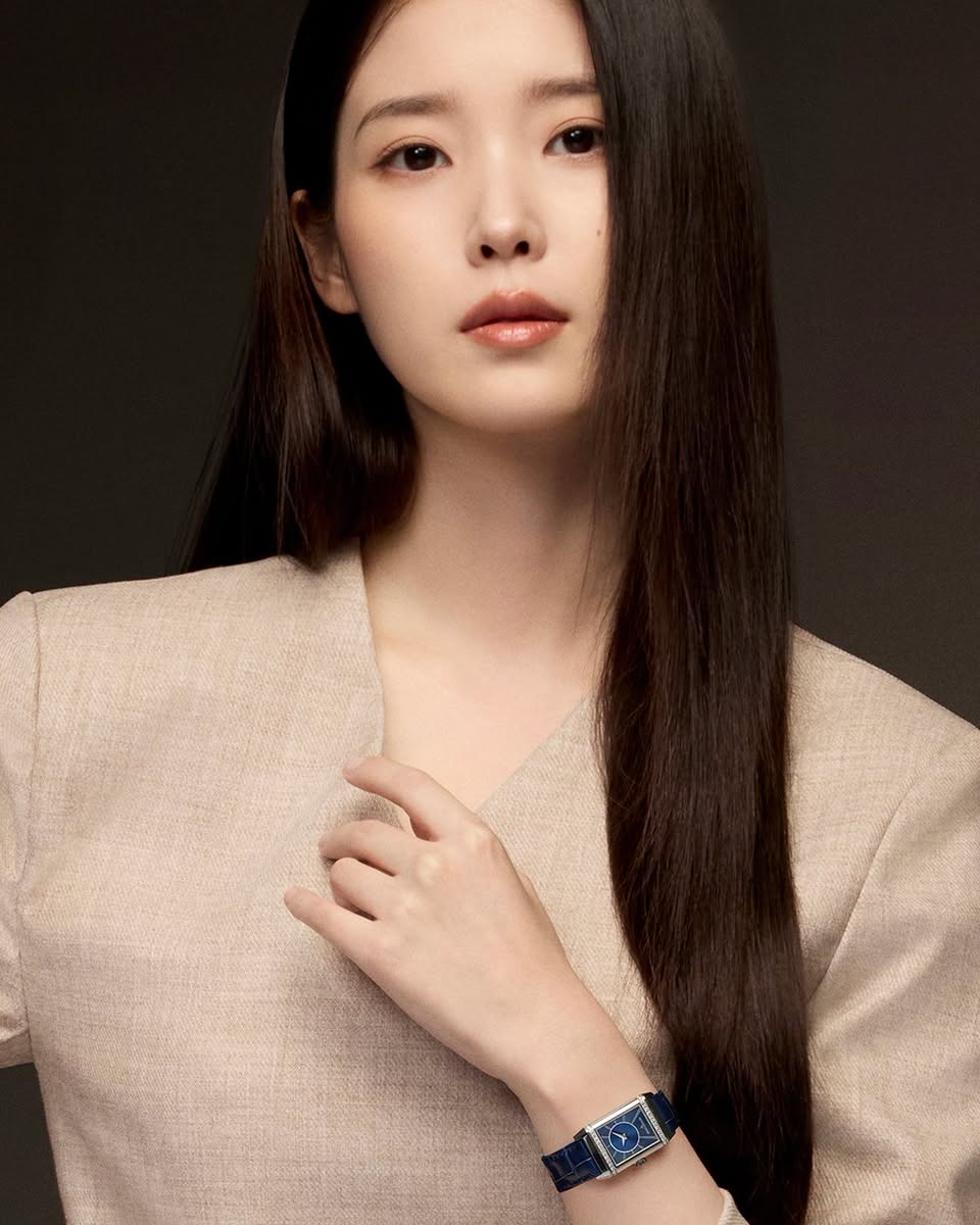 IU wearing a beige blazer and blue-strapped watch for Jaeger-LeCoultre campaign