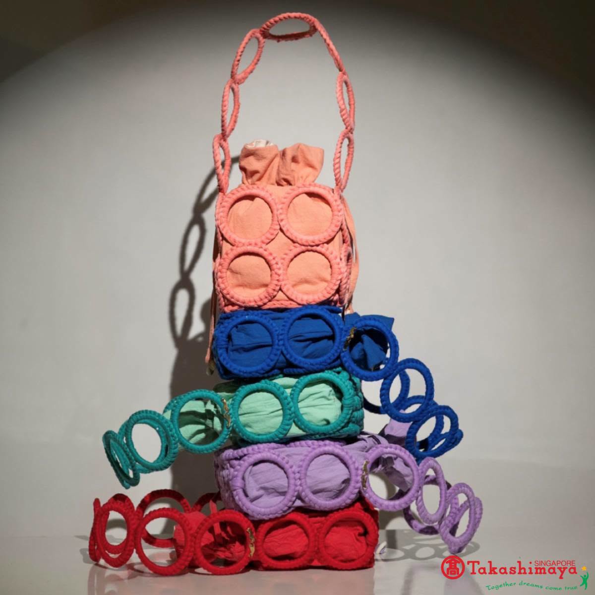 Webeings crocheted handbags in coral, blue, mint green, lavender and red at Takashimaya