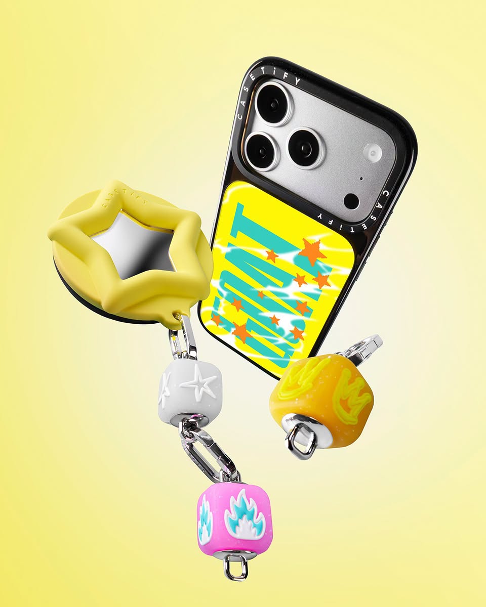 CASETiFY phone case with WANT graphic and charm cubes