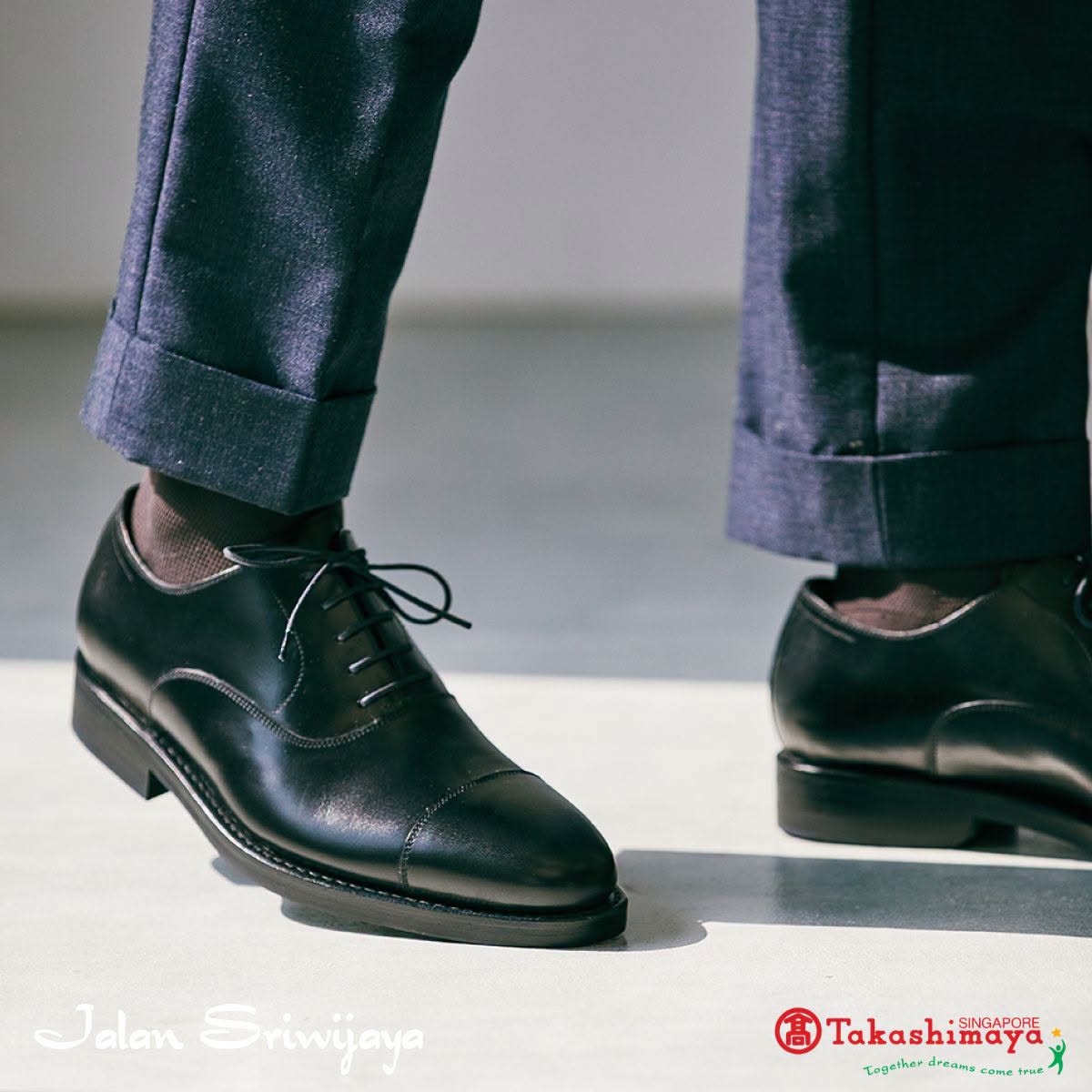 Black leather lace-up dress shoes by Jalan Sriwijaya at Takashimaya Singapore