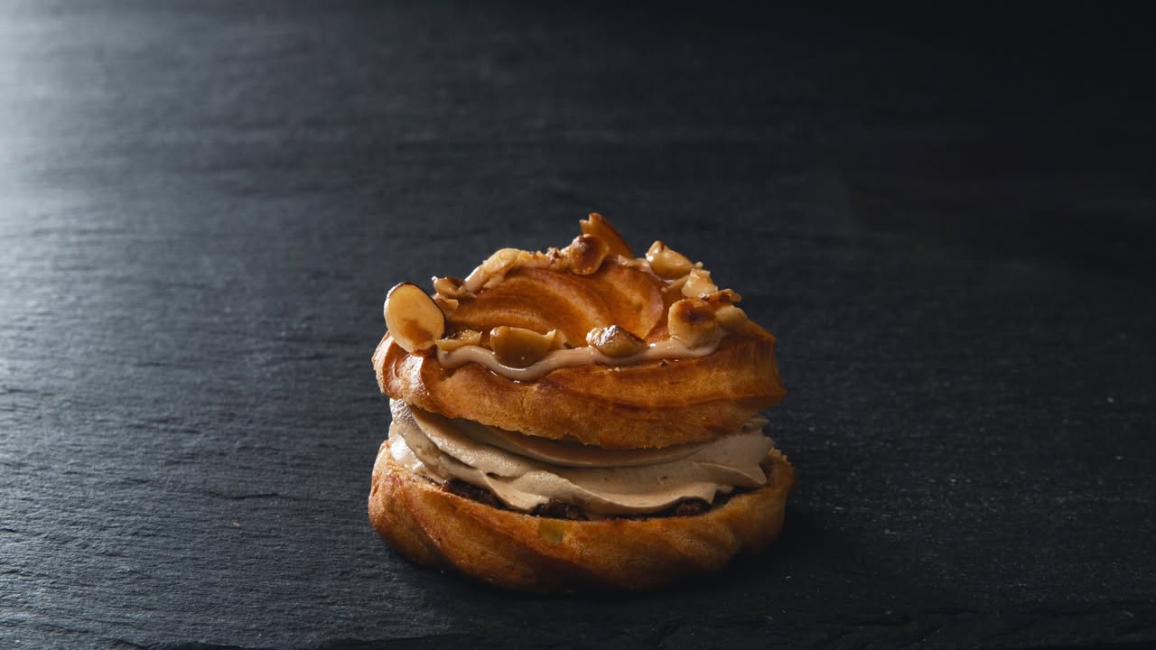Layered pastry with cream filling and sliced almonds at Maison Paul