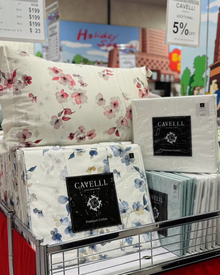 CAVELLI Premium Cotton bedding with floral-patterned pillows and sheets