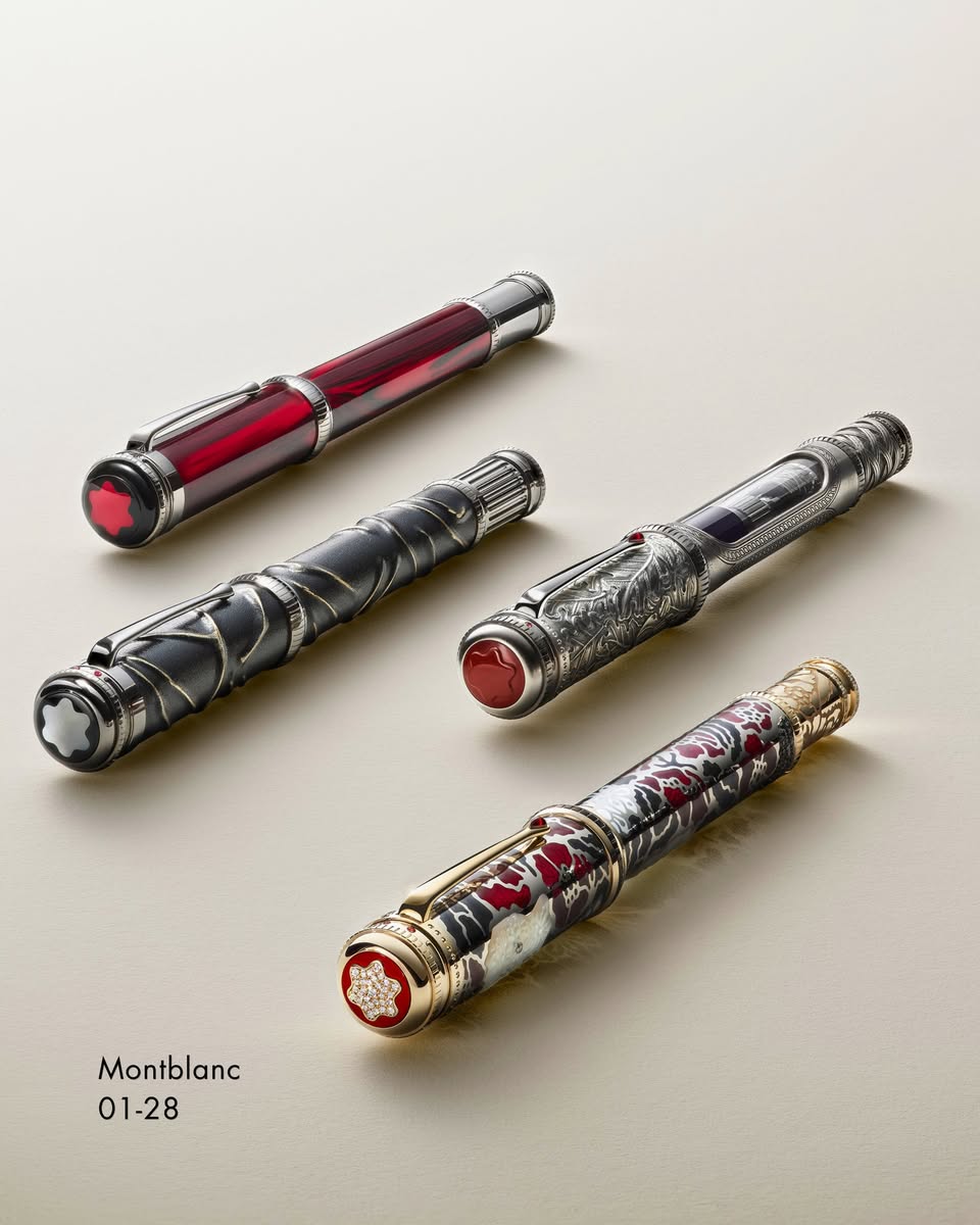Four Montblanc Writers Edition fountain pens including red translucent barrel and dragon motif designs