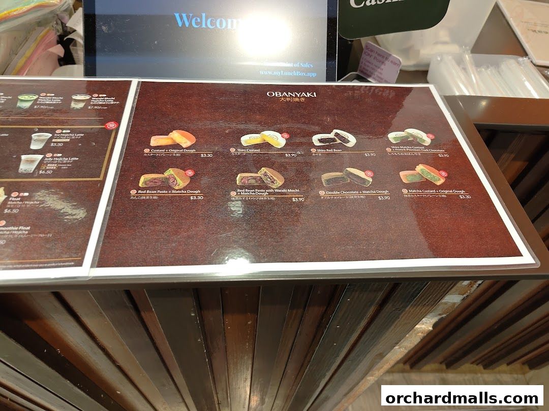 A menu display featuring various Japanese sweets and drinks from 108 Matcha Saro.