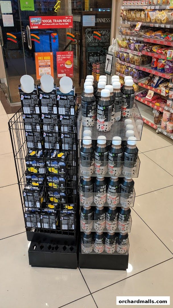 Display of bubble milk tea and Himalayan salt products outside a 7-Eleven store.