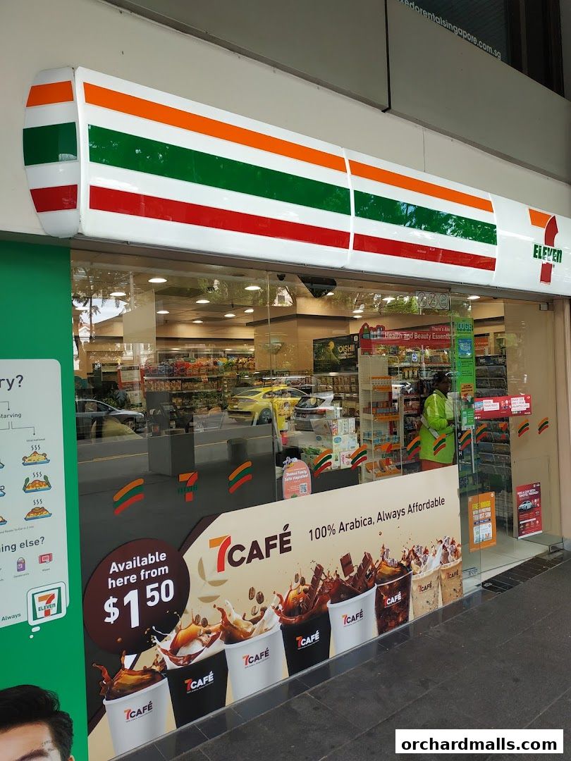 Exterior of a 7-Eleven convenience store with a prominent 7CAFÉ advertisement.