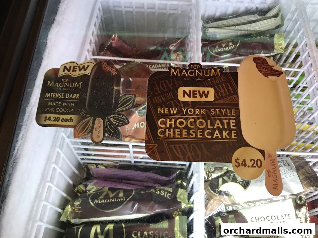 A freezer display filled with various Magnum ice cream bars, featuring new flavors.