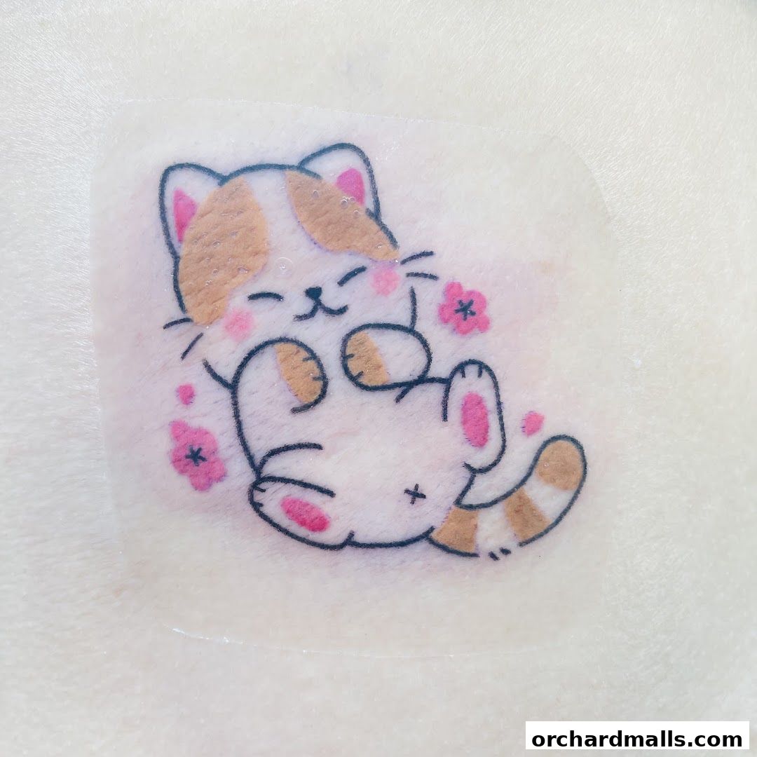 A cute, cartoon-style cat tattoo design with pink flowers on skin.