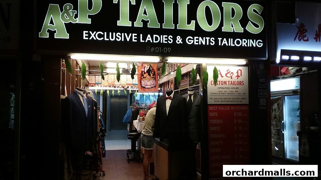 A&P Custom Tailors shop front with mannequins displaying suits and a price list.