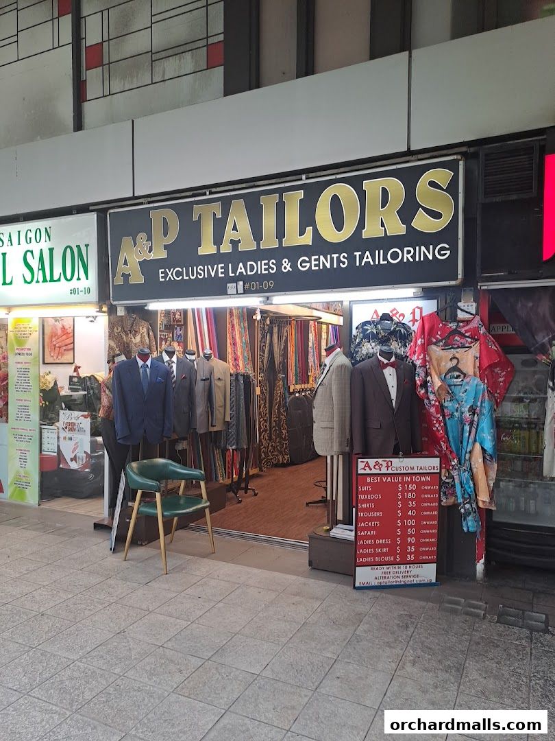 A&P Custom Tailors shop front displaying suits, fabrics, and a price list.