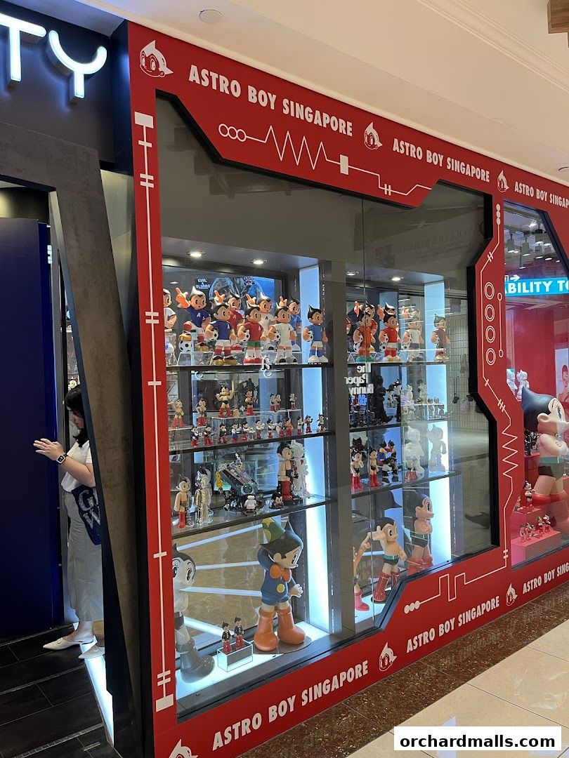 Astro Boy Singapore shop front displaying numerous Astro Boy figurines in display cases.