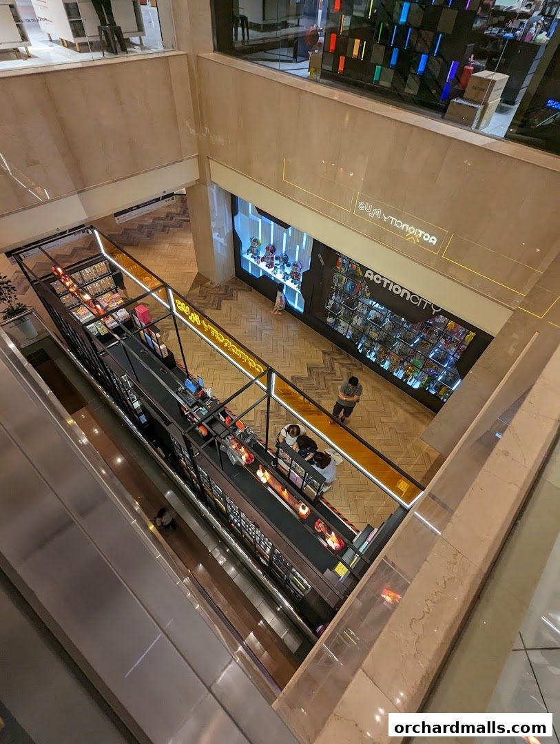 View of ActionCity store with toys and collectibles displayed, and shoppers browsing.