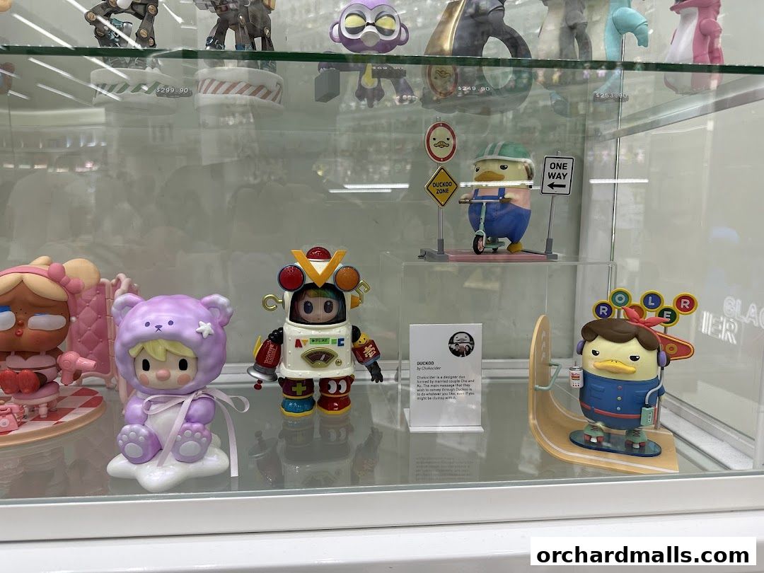 Display case filled with collectible designer toys and figurines.