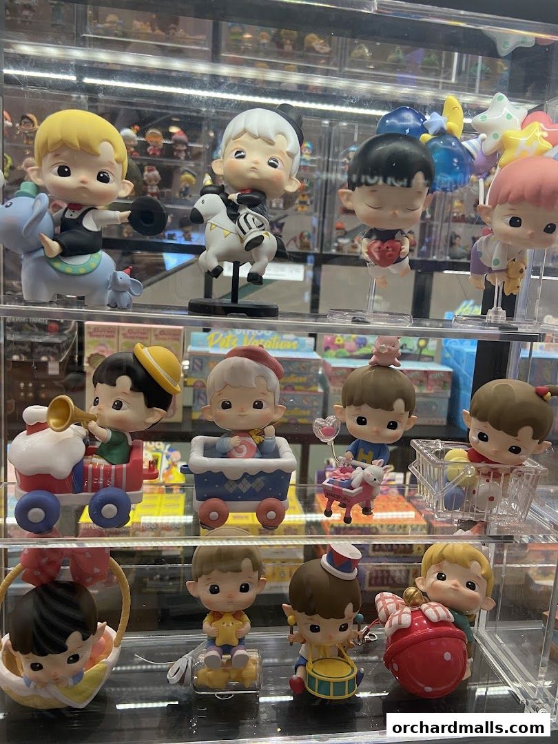 Display of cute collectible figurines in various whimsical poses and outfits.