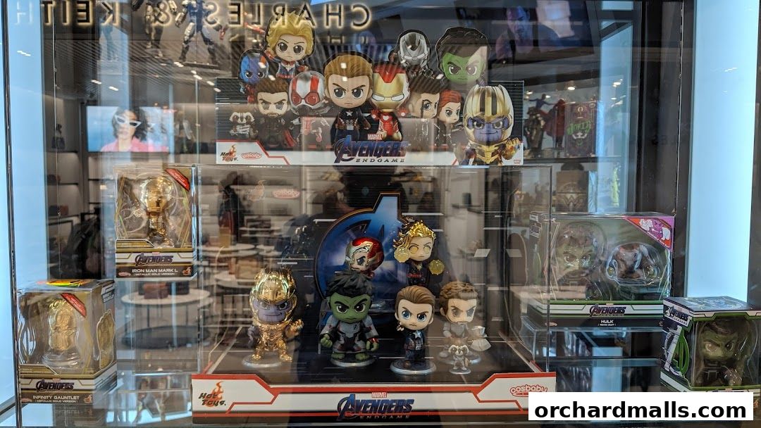 Display case filled with Marvel Avengers Endgame collectible figures and merchandise.