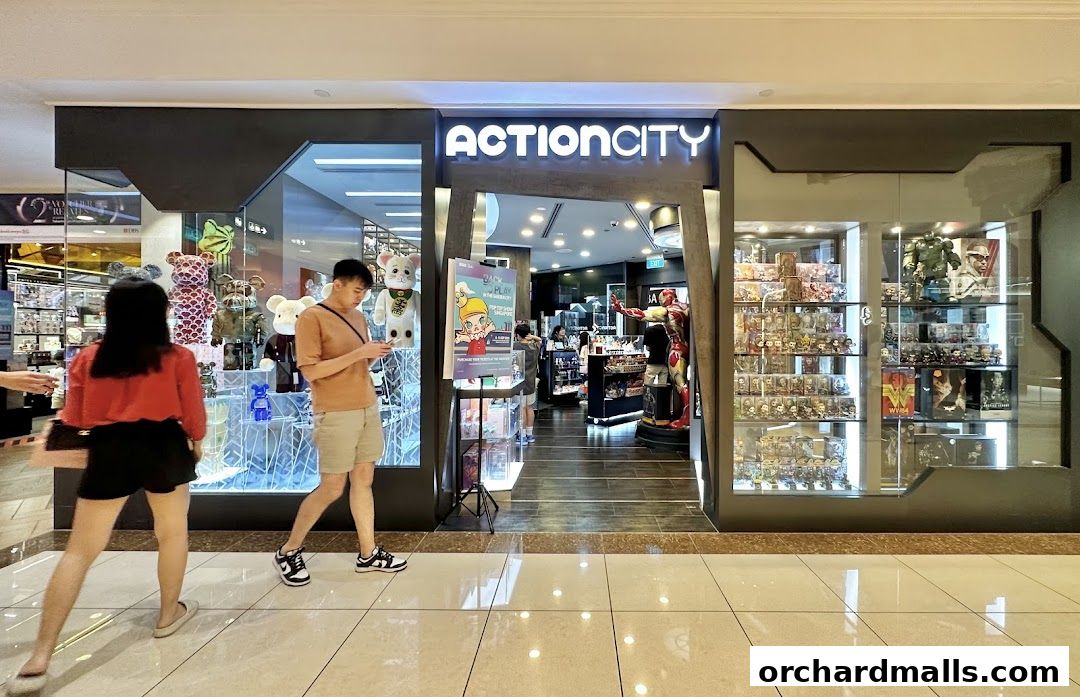 ActionCity store entrance showcasing collectible toys and figures in display cases.