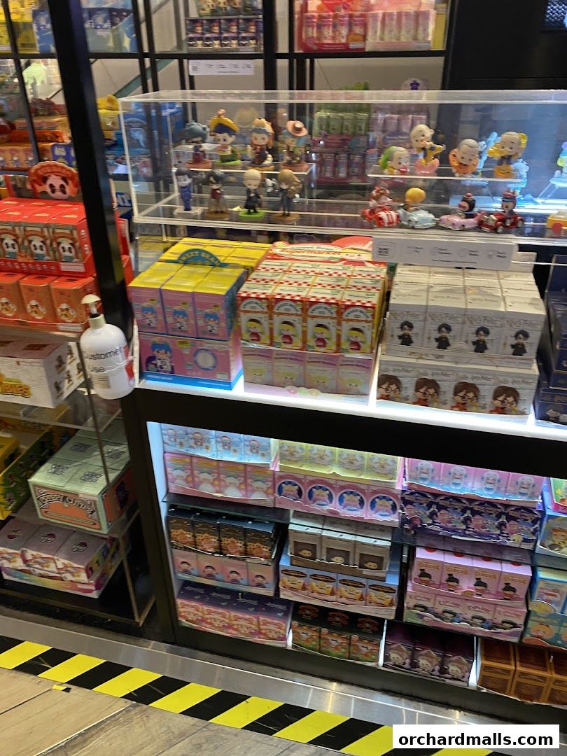 A display of blind box toys and collectible figures in a retail store.