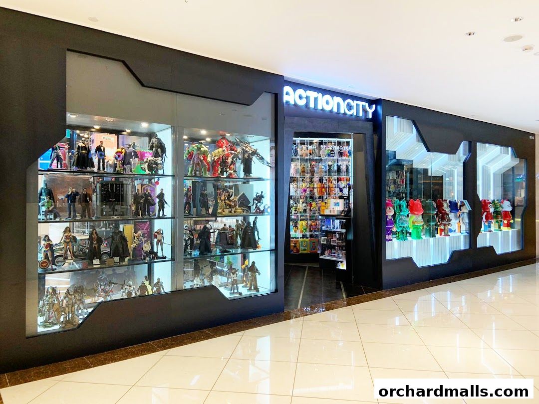 ActionCity store entrance showcasing a wide variety of collectible figures and toys in display cases.