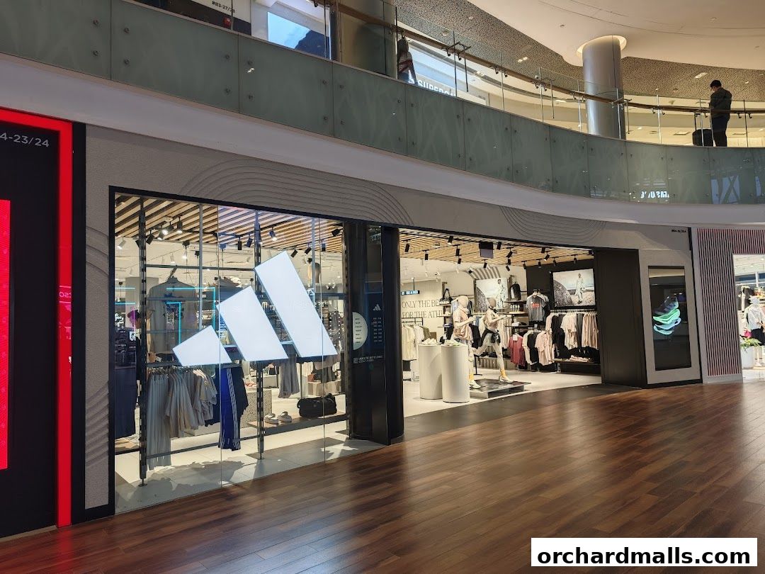 The Adidas Performance Store at Ion Orchard showcases athletic apparel and footwear with prominent branding.