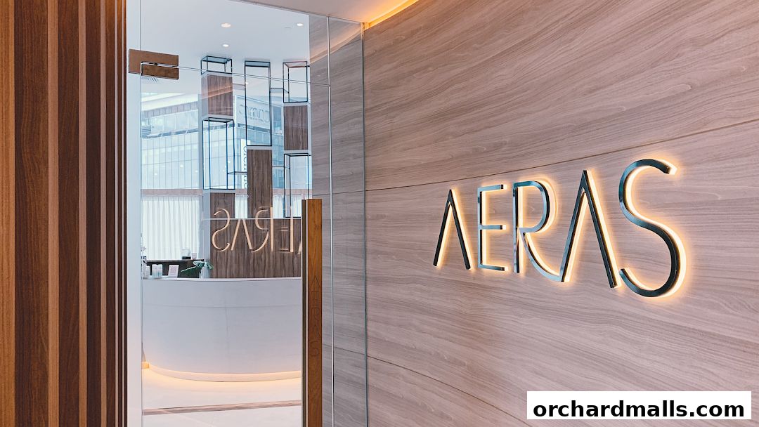 The entrance to Aeras by Mizu, featuring a modern reception area and illuminated signage.
