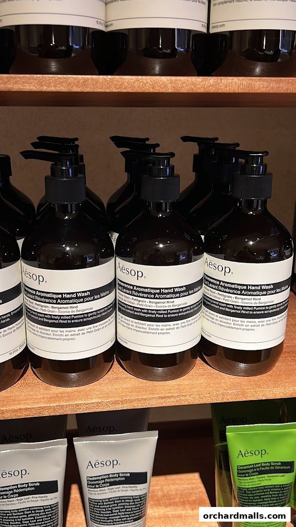 Shelves stocked with Aesop hand wash and body scrub products.
