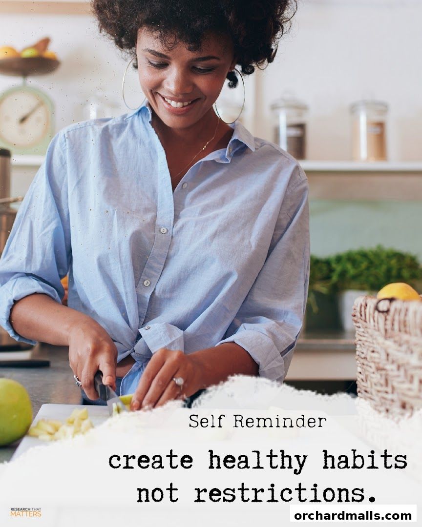 A woman smiles while preparing healthy food, with a motivational quote about habits.