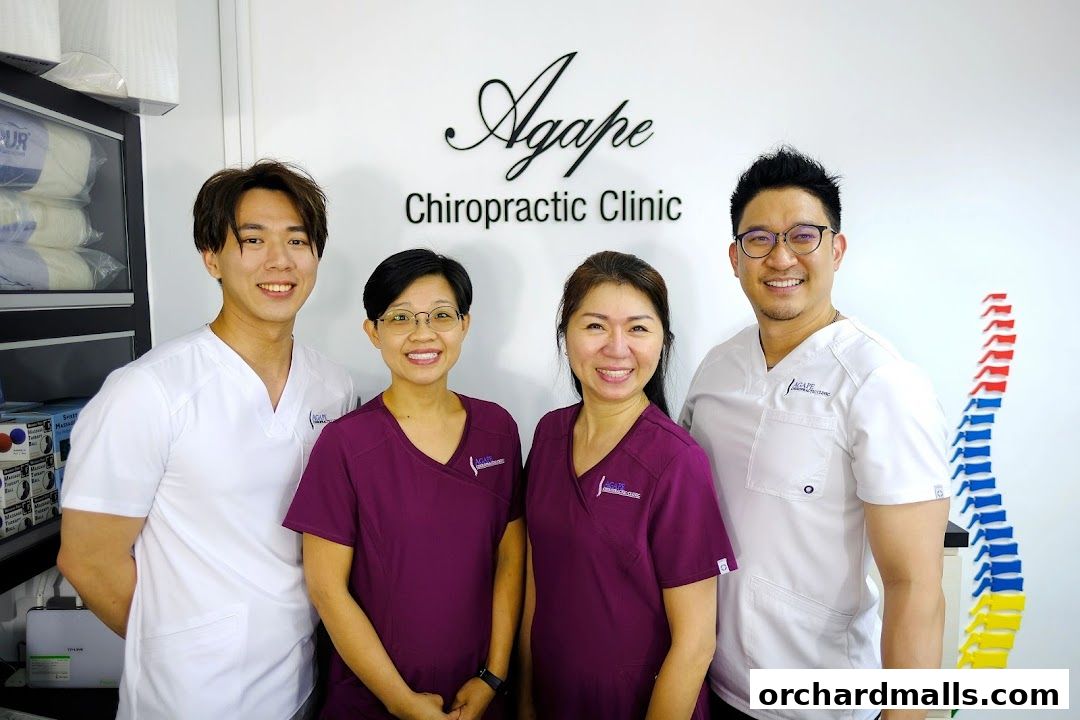 Agape Chiropractic Clinic staff posing for a photo in their clinic.