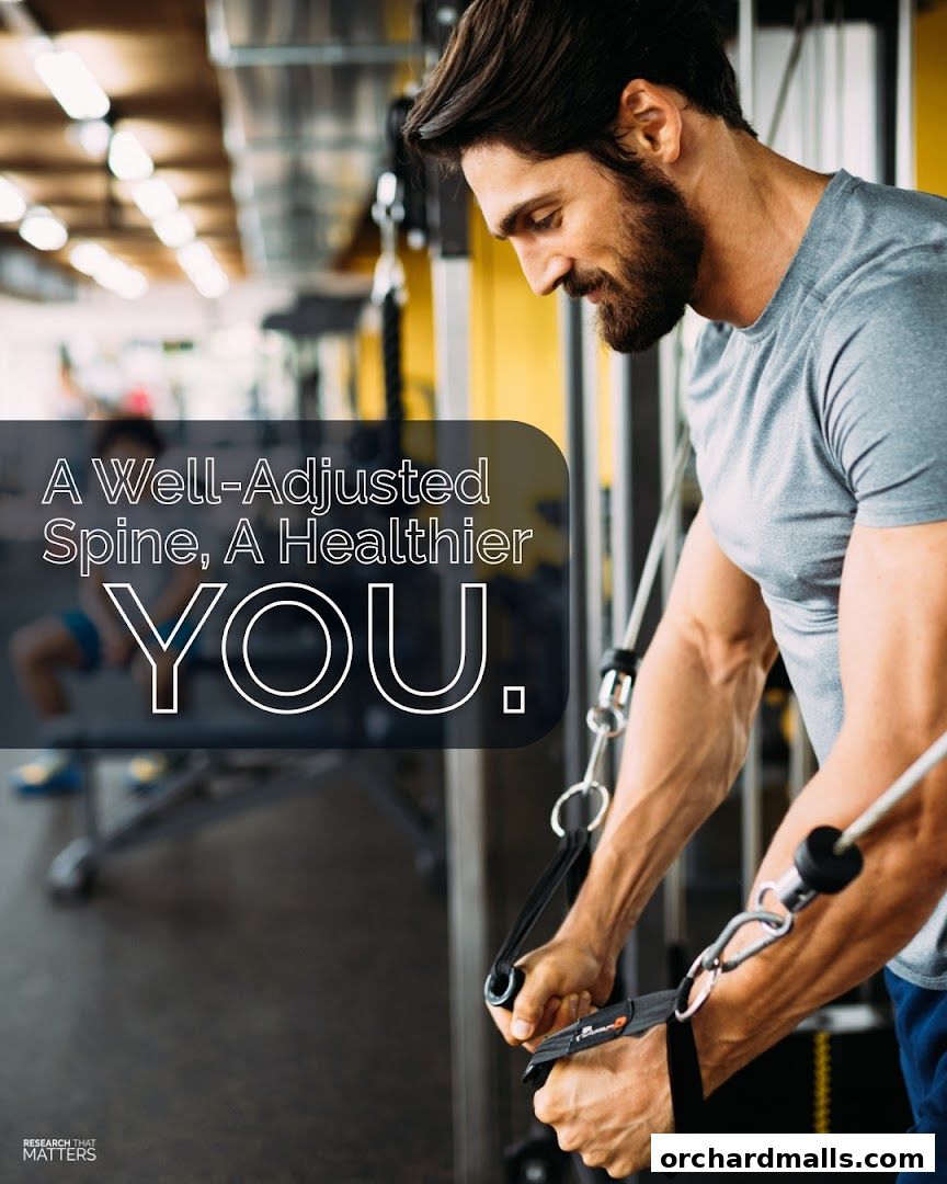 Man exercising with a cable machine, promoting chiropractic care for a healthier spine.