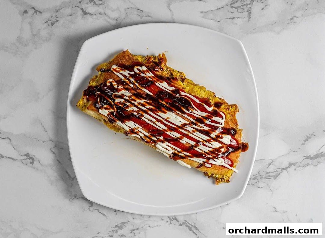 A delicious-looking dish with sauces drizzled on top, served on a white plate.