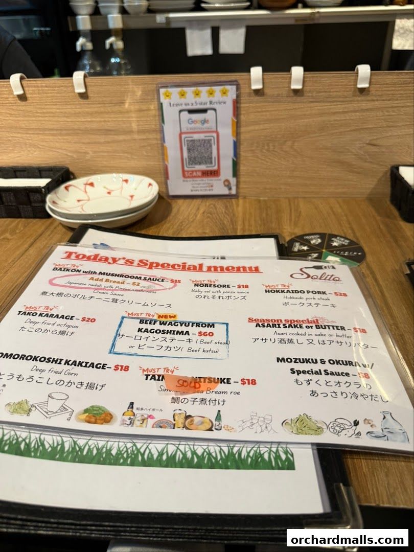 A menu from AL Solito Japanese Italian Izakaya featuring special dishes and must-try items.