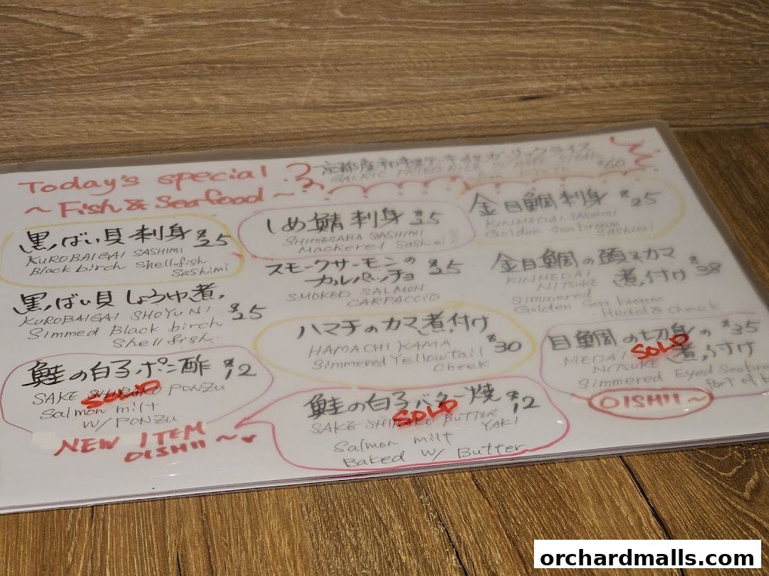 A handwritten menu board featuring today's fish and seafood specials.