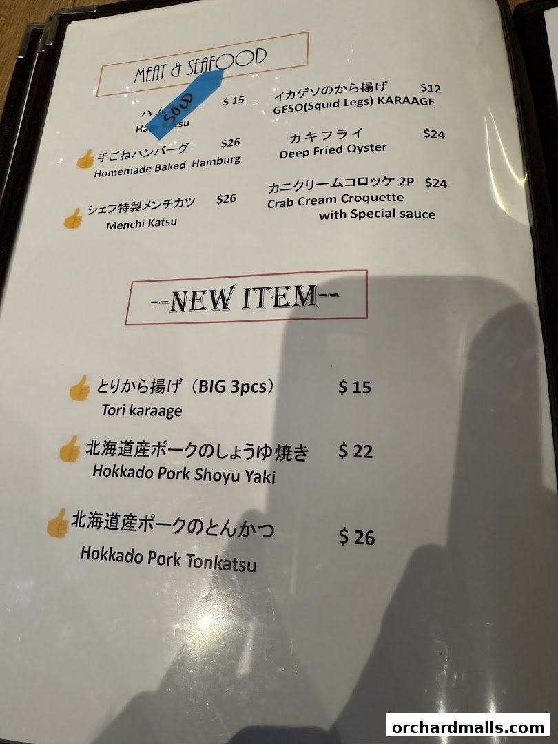 A menu from AL Solito Japanese Italian Izakaya featuring meat and seafood dishes.