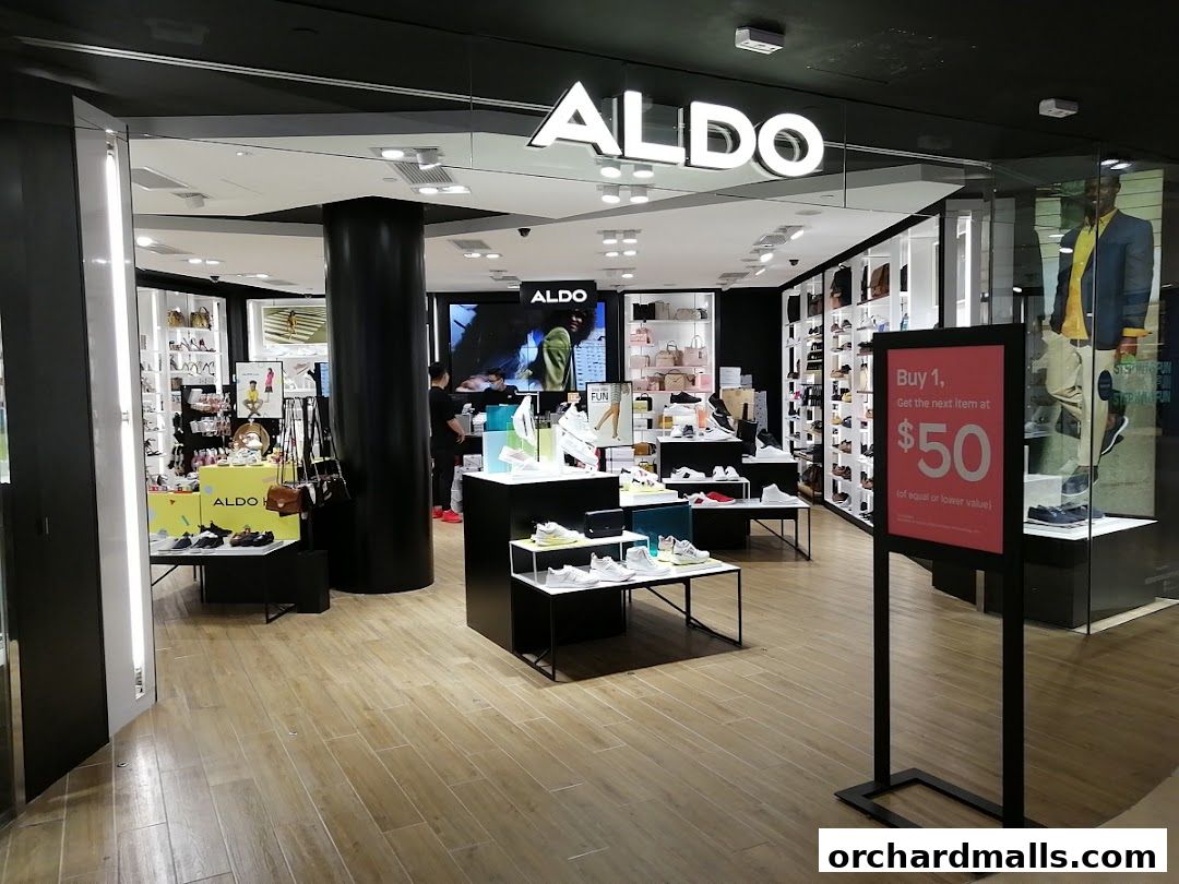 The ALDO store entrance showcasing shoes and bags with a promotional sign.