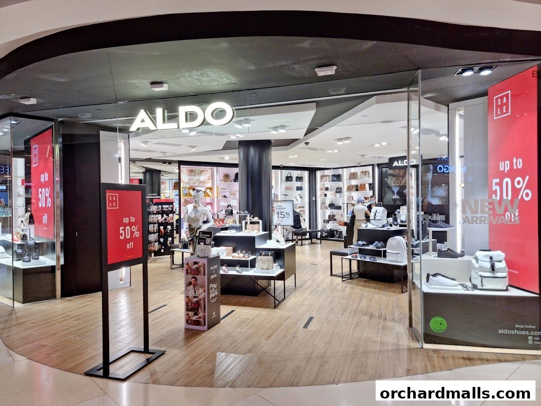 The ALDO store entrance displays a sale with up to 50% off and new arrivals.