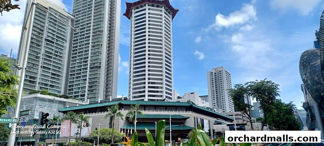 A street view of the ALDO ION Orchard store with surrounding modern buildings.