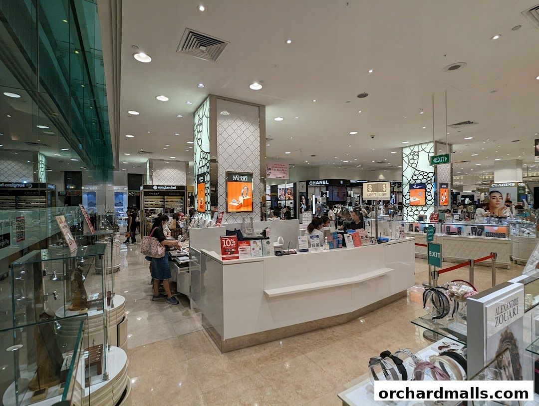 Interior view of a department store featuring beauty and accessory counters.