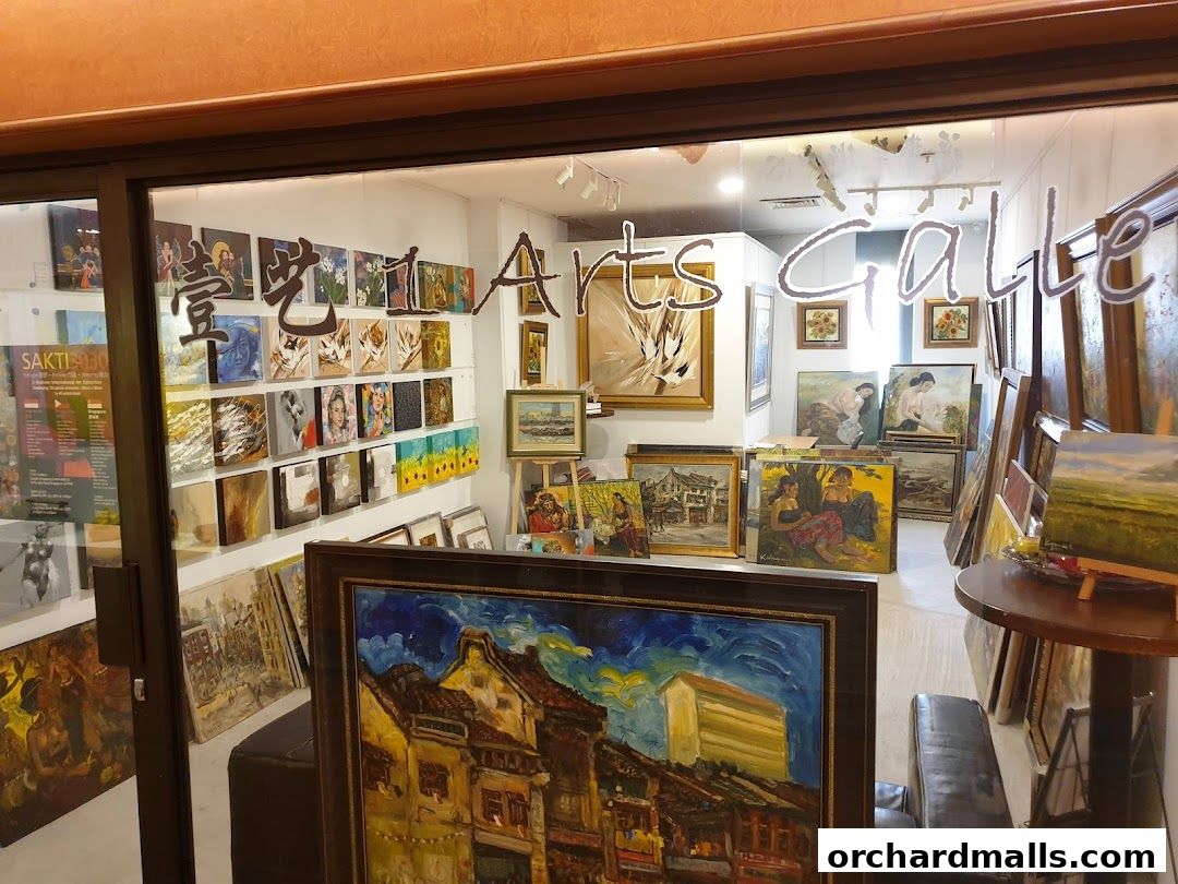 Interior view of an art gallery showcasing a diverse collection of paintings and artworks.