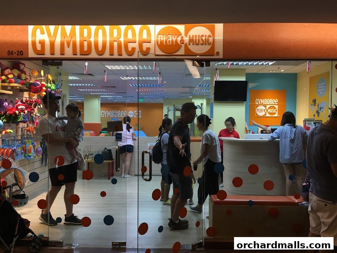 Entrance to Gymboree Play & Music with toys and people inside.