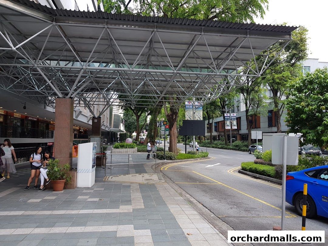 Exterior view of Andric Leasing shop with a modern canopy and street view.