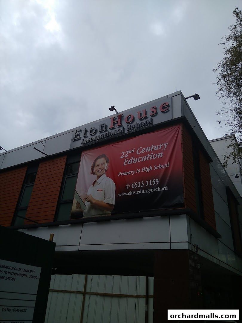 Exterior of Eton House International School with a banner advertising 22nd Century Education.
