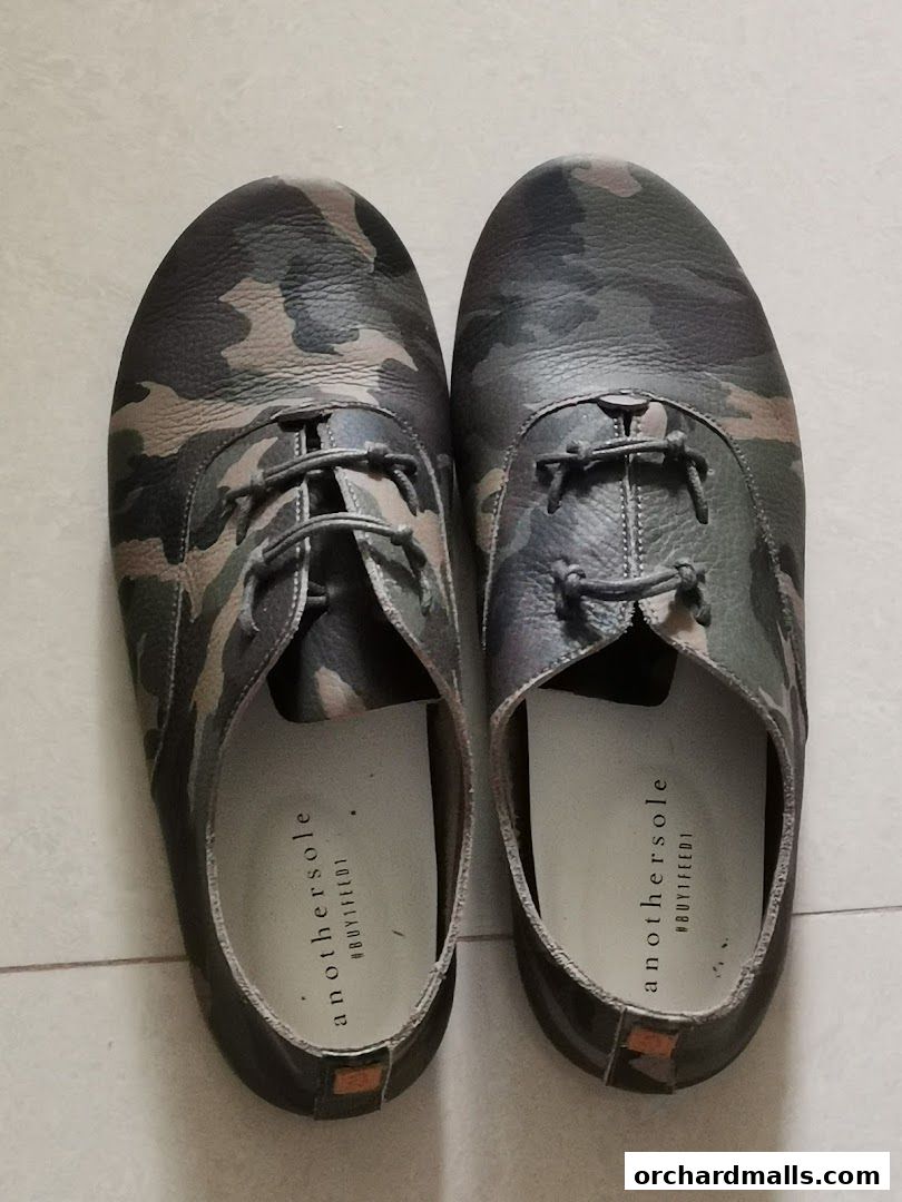 A pair of camouflage print leather shoes with laces from Anothersole.