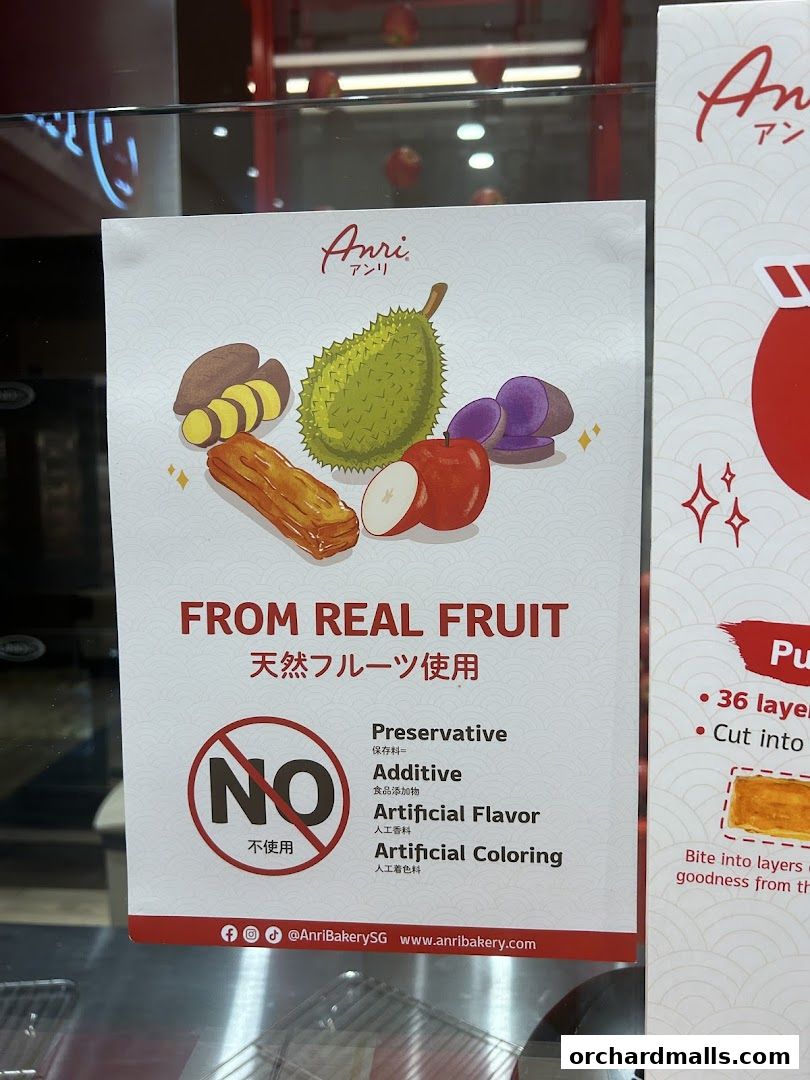 A sign from Anri bakery highlighting the use of real fruit and absence of artificial ingredients.