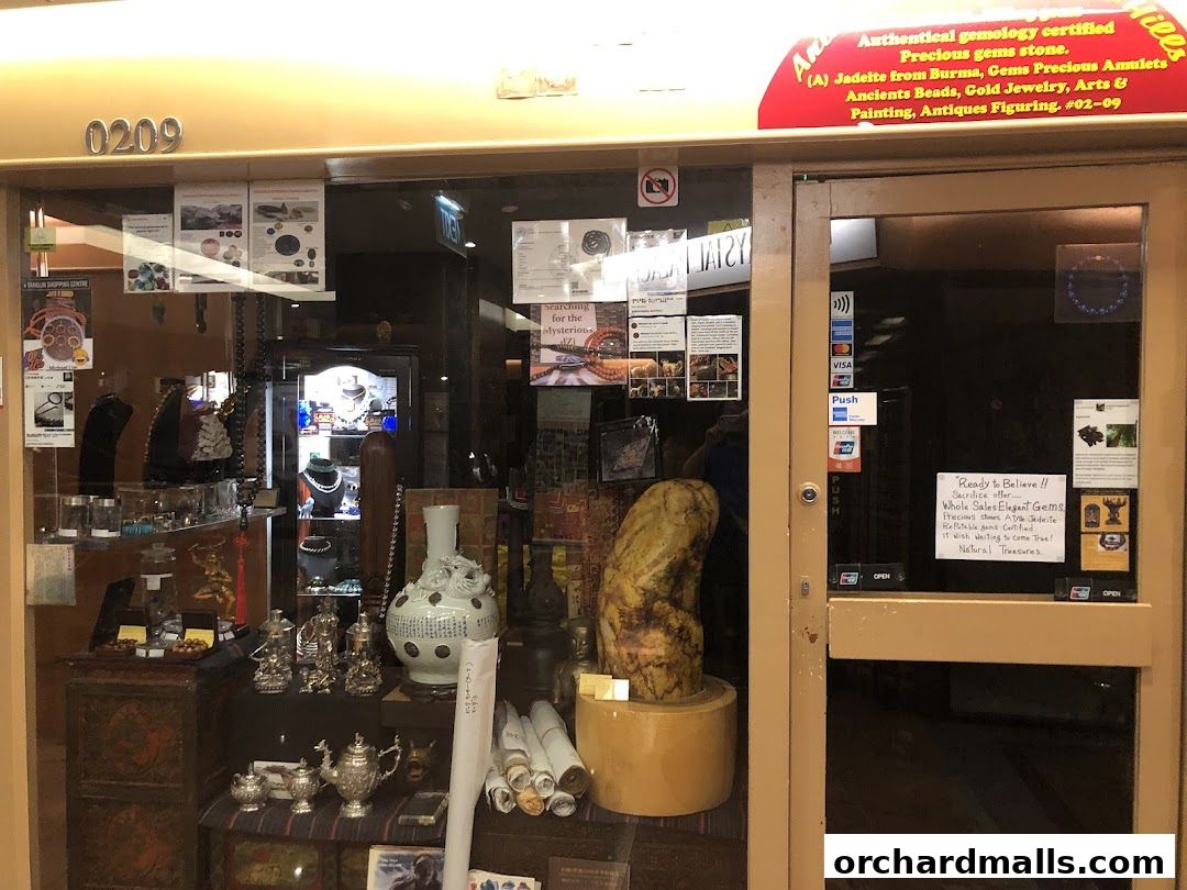Shop front displaying authentic gemstones, jewelry, arts, and antiques.